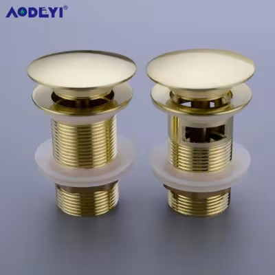 Sistema di scarico per lavabo in ottone color oro con sifone