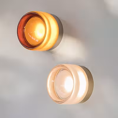 Modern LED wall sconce with amber and smoked glass accents, suitable for living rooms, hallways, bedrooms, and dining rooms