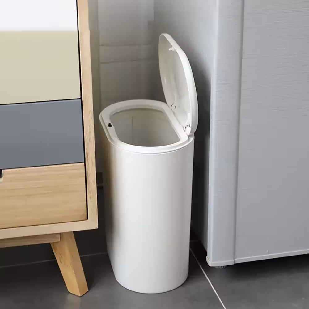 Garbage bin with toilet brush