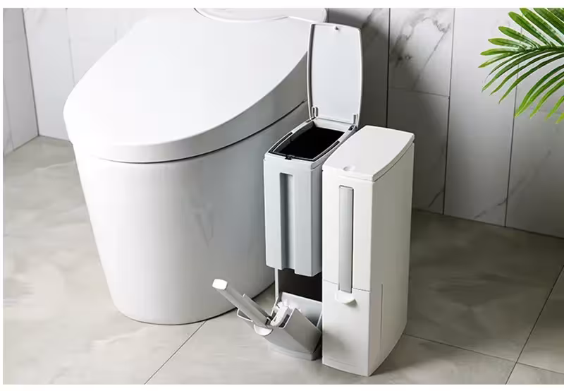 Garbage bin with toilet brush