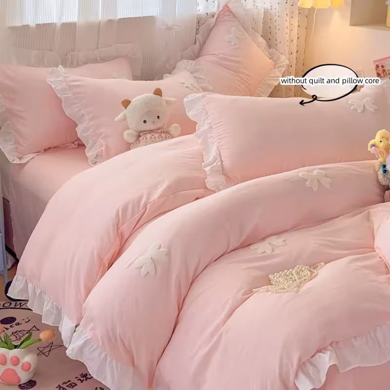 Jeu de literie 3 pièces avec broderie rose en forme de ruban, comprenant une housse de couette et des taies d'oreiller.